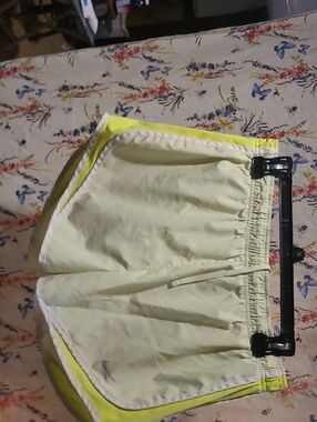 Nike Women’s Light Yellow Athletic Shorts with Neon Yellow Trim and White Piping